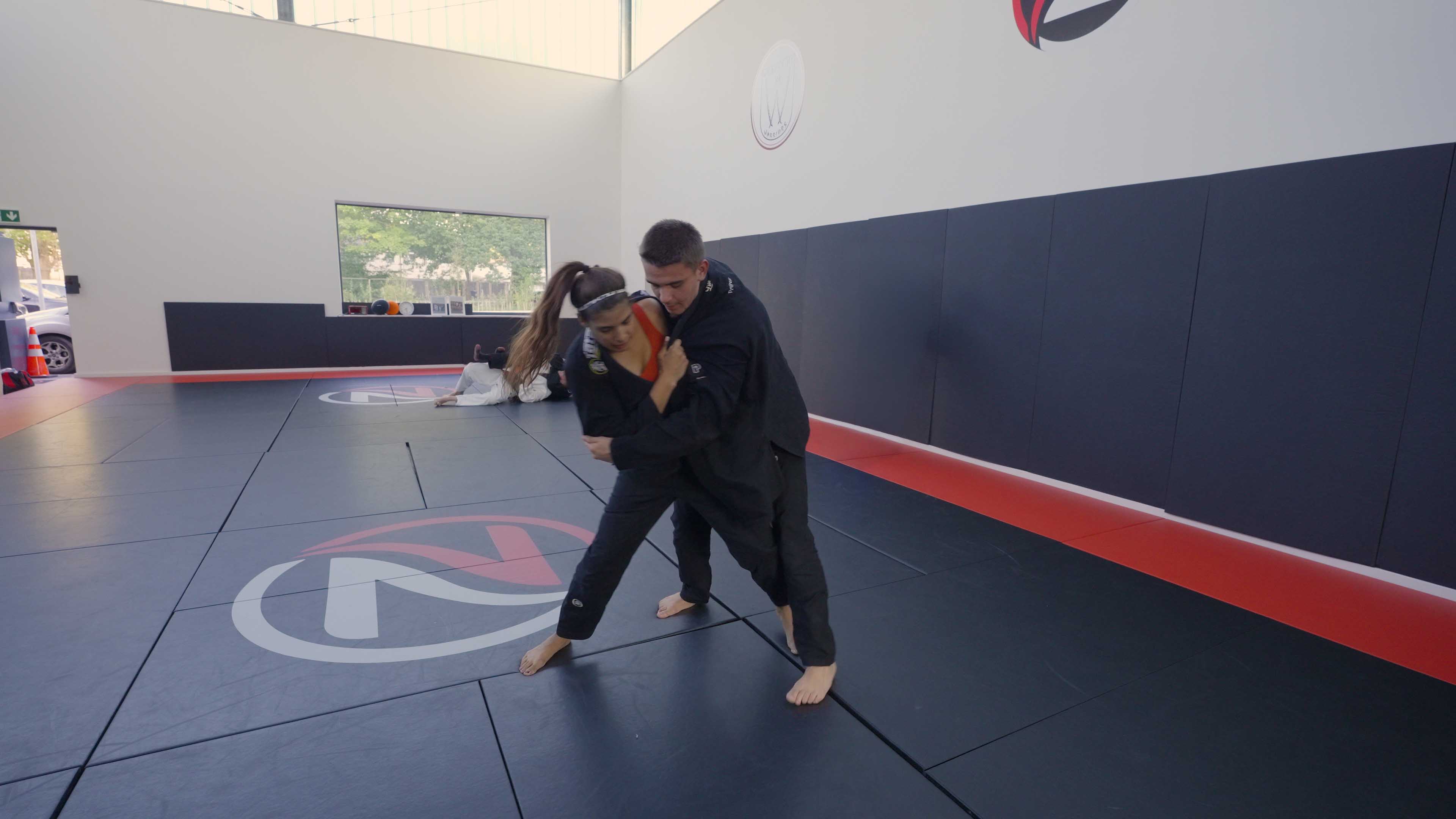 Two judoka grip fighting from a standing clinch at Zilla Training